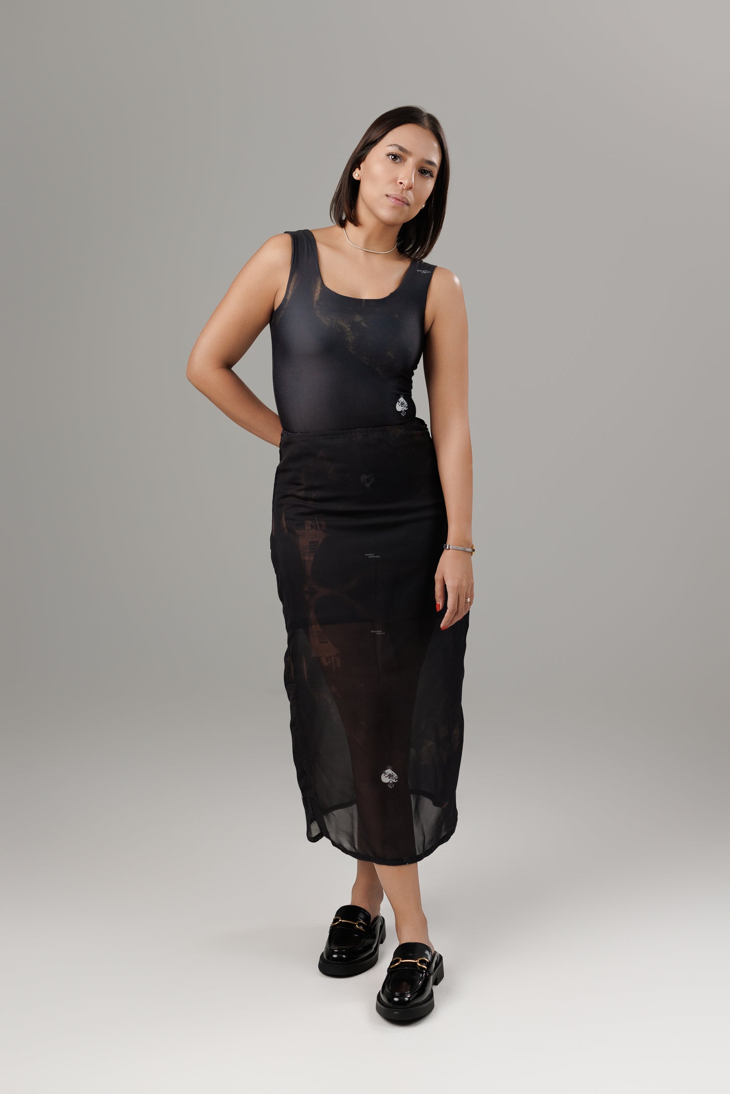 SOMBRAS DE FUEGO TRANSPARENT MIDI SKIRT